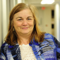 Picture: Cheryl Bates-Harris, Senior Disability Advocacy Specialist from the National Disability Rights Network. A white, middle-aged woman with blonde hair wearing a white shirt with a blue jacket